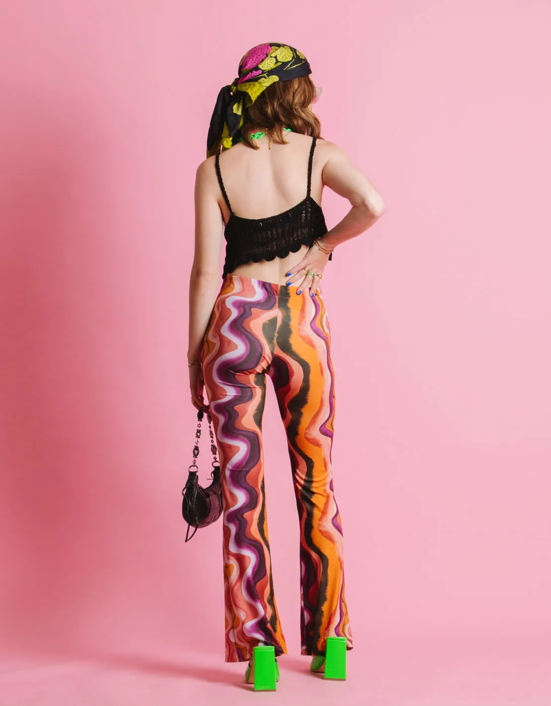 Swirl flared elastic trousers